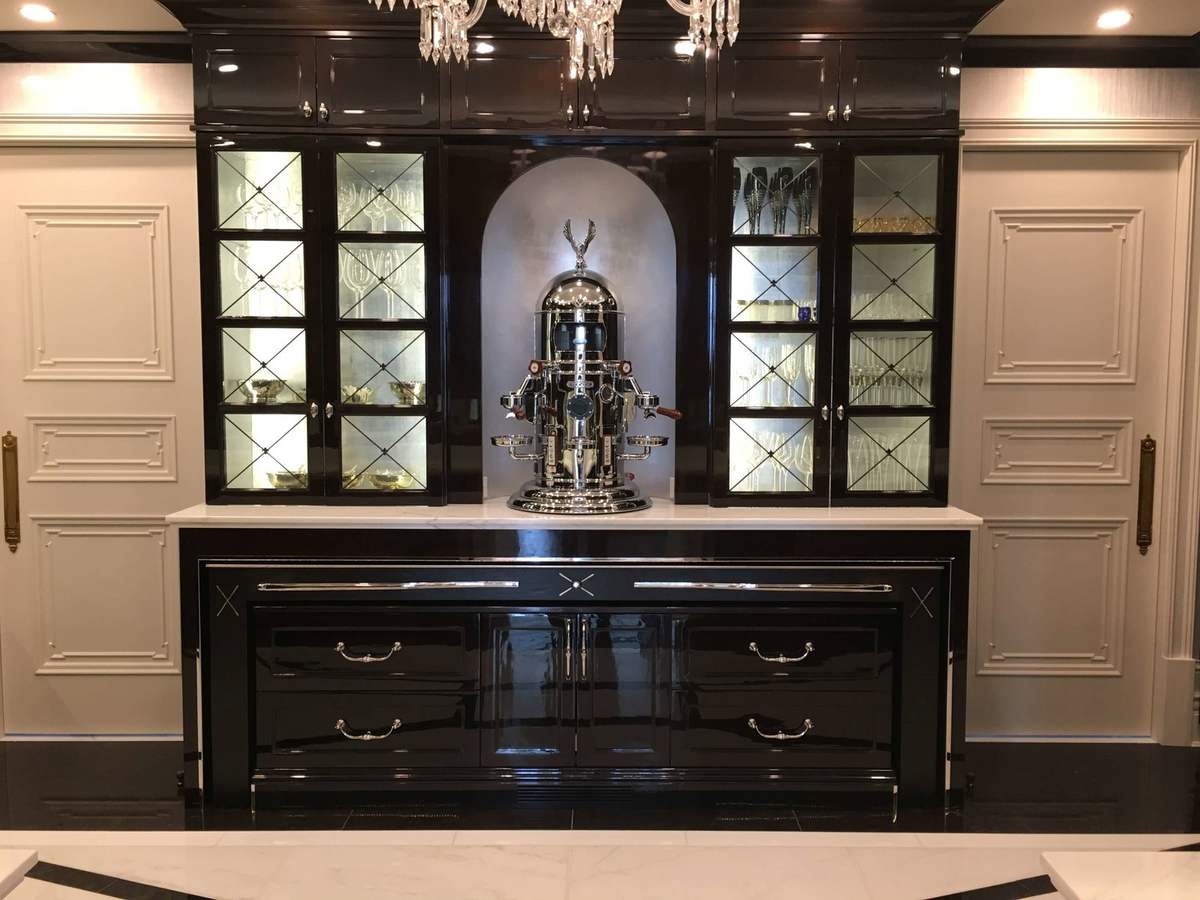 Black display cabinet with glass doors and paneled surround